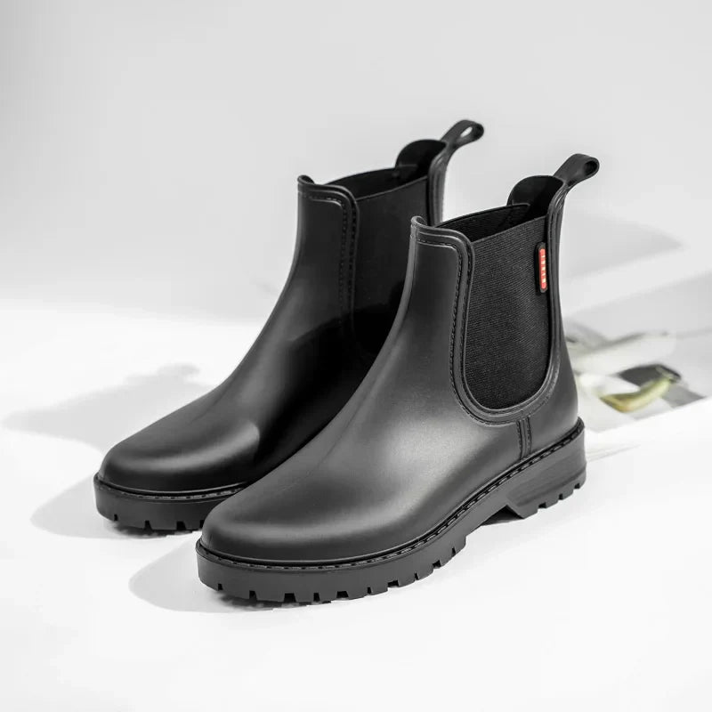 Durable women's ankle boots: black, waterproof, and insulated Chelsea style.