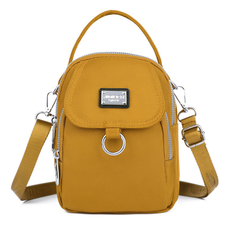 Practical women's waterproof crossbody bag in sleek oxford material, hands-free design