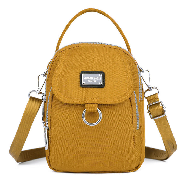 Practical women's waterproof crossbody bag in sleek oxford material, hands-free design