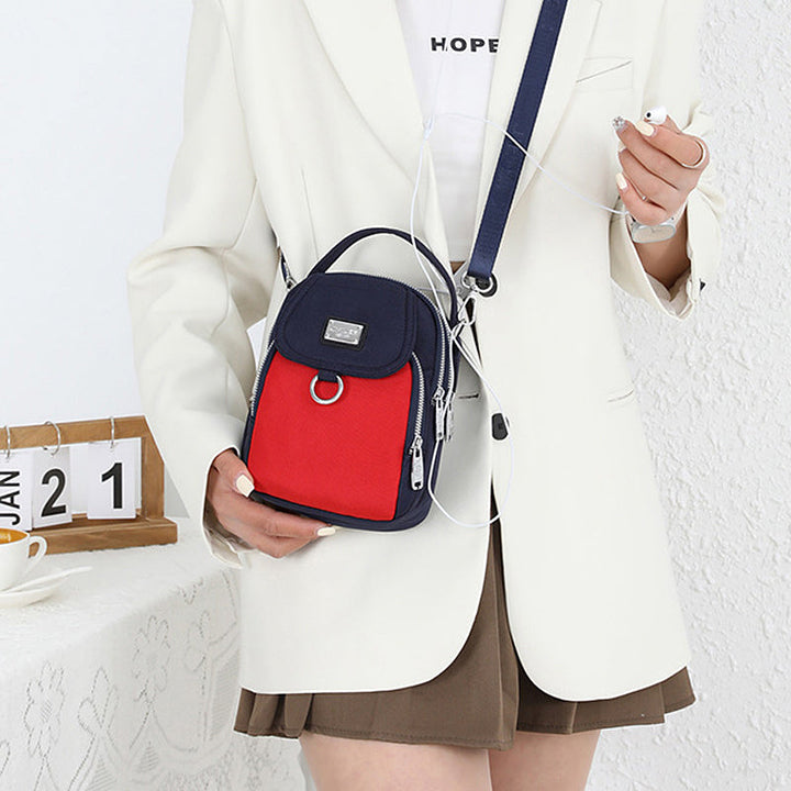 Stylish women's waterproof crossbody bag in oxford fabric, ideal for travel