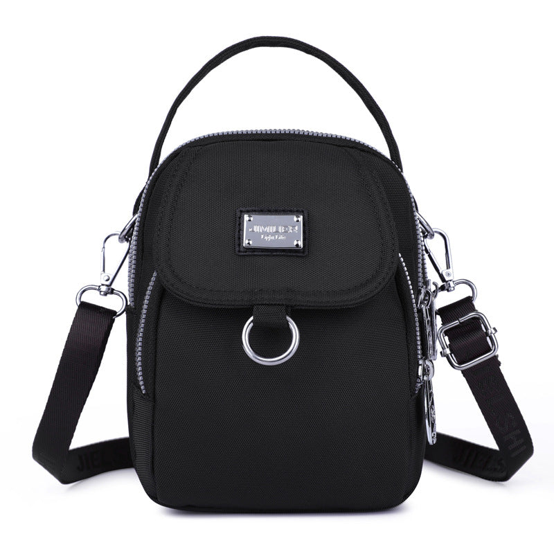 Women's waterproof crossbody bag, offering protection from rain, oxford material