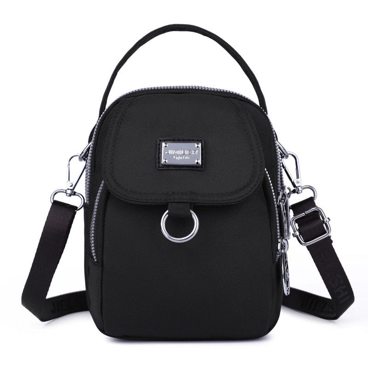 Women's waterproof crossbody bag, offering protection from rain, oxford material