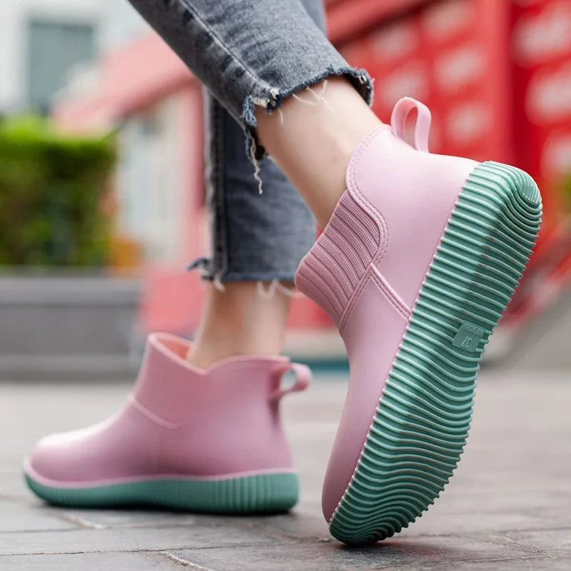 Women's waterproof rain ankle boots with knitted comfort and non-slip sole, perfect for wet weather.