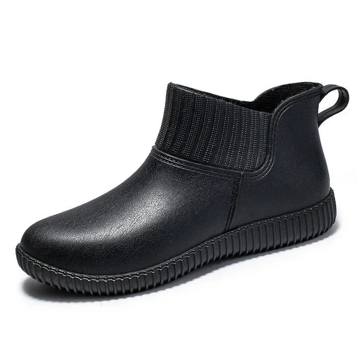 Stylish women's waterproof ankle rain boots with comfortable knitted shaft, ideal for fall fashion.