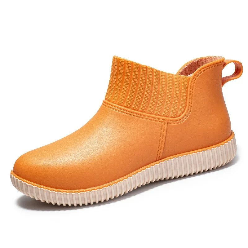 Durable women's rain ankle boots, waterproof with a cozy knitted cuff & non-slip sole for weather protection.