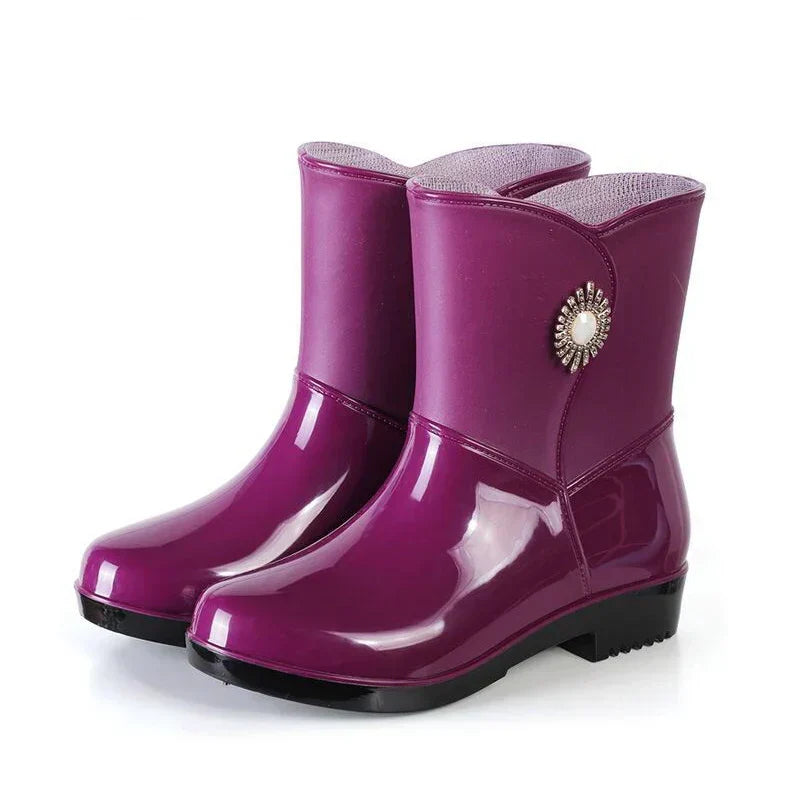 Stylish women's rain boots: waterproof, floral pattern, robust treaded sole for wet outdoor autumn days.