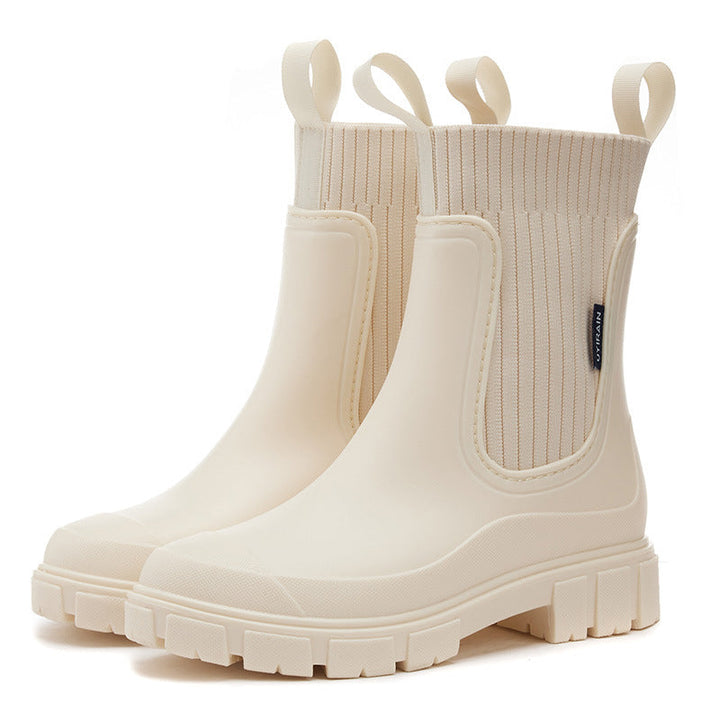 Stylish women's waterproof boots, ultimate grip with thick tread, perfect for rainy days.