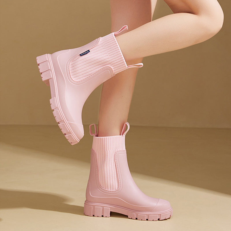 Comfortable women's waterproof boots, thick tread sole for grip, ideal for rainy days.