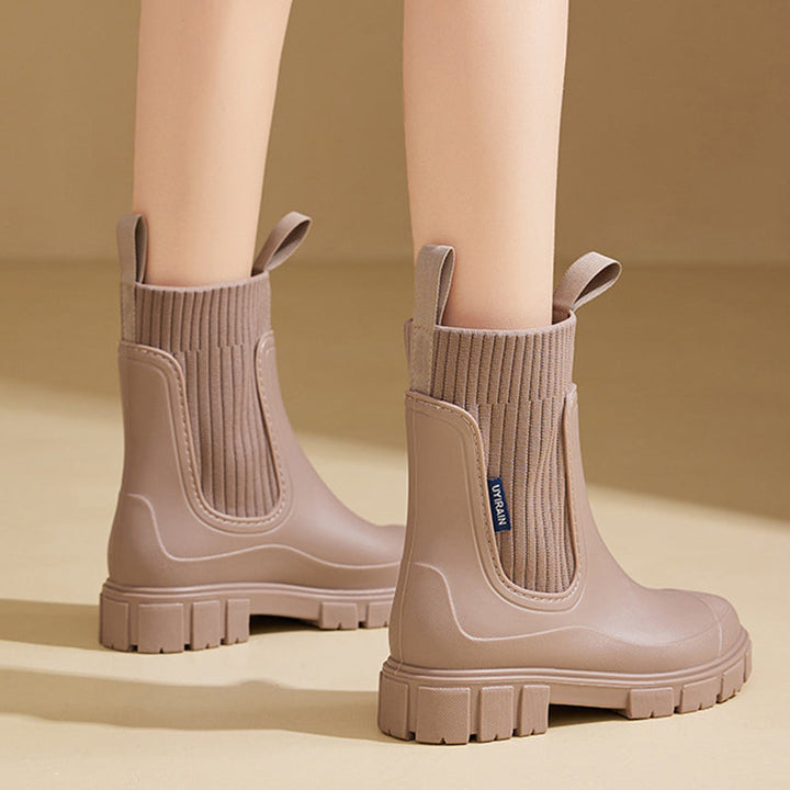 Waterproof women's outdoor footwear, thick sole, ultimate grip, comfortable for wet conditions.