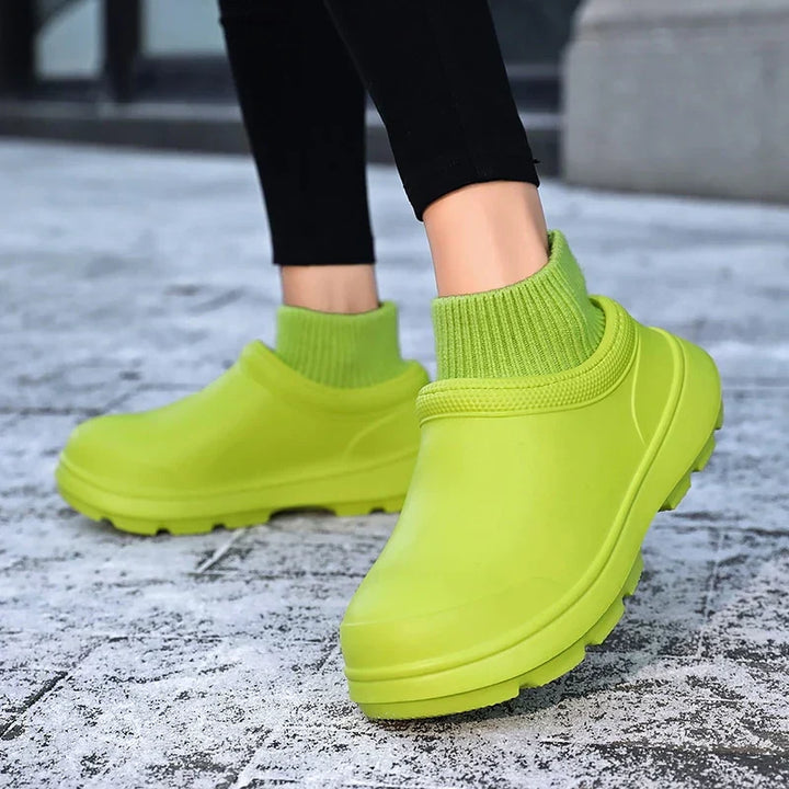 Side profile of Madeline women's waterproof clogs with a cozy knitted ankle cuff and sturdy sole.