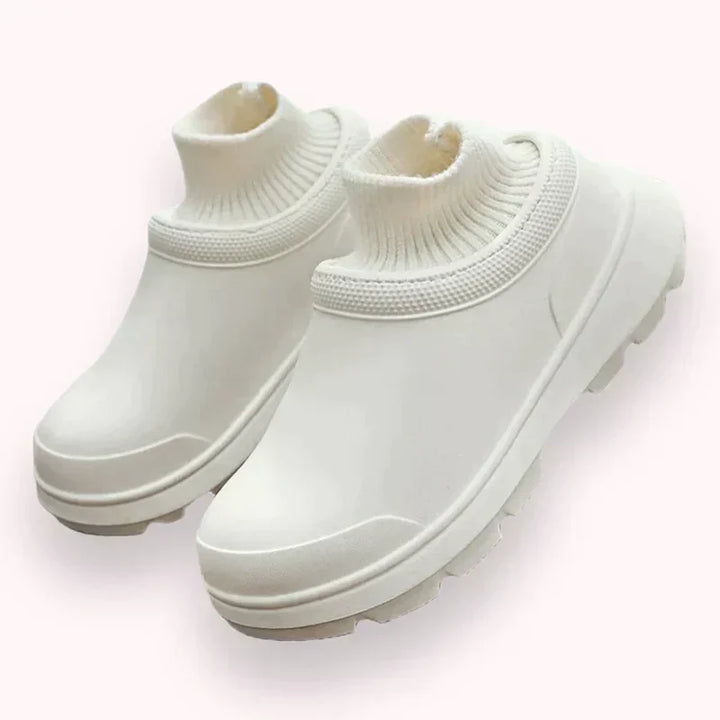 Madeline women's waterproof clogs featuring a cozy knit cuff and non-slip sole for everyday wear.