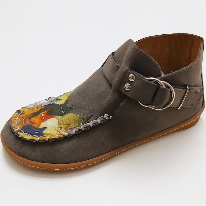 Side view of women's slip-on casual shoes, featuring a charming whimsical cat face motif