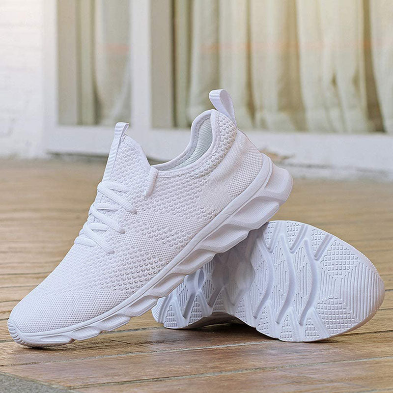 Women's white breathable lace-up trainers, ideal for everyday wear and walking, showing side profile