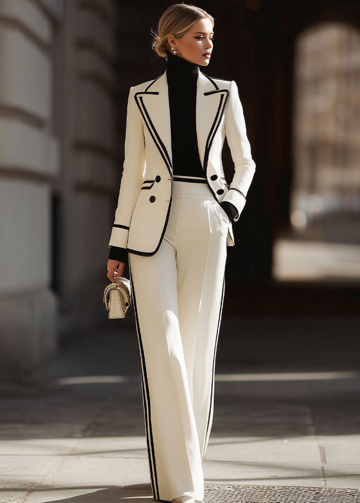 Women's white double-breasted blazer and wide-leg trousers suit set with contrast trim, ideal for formal wear.