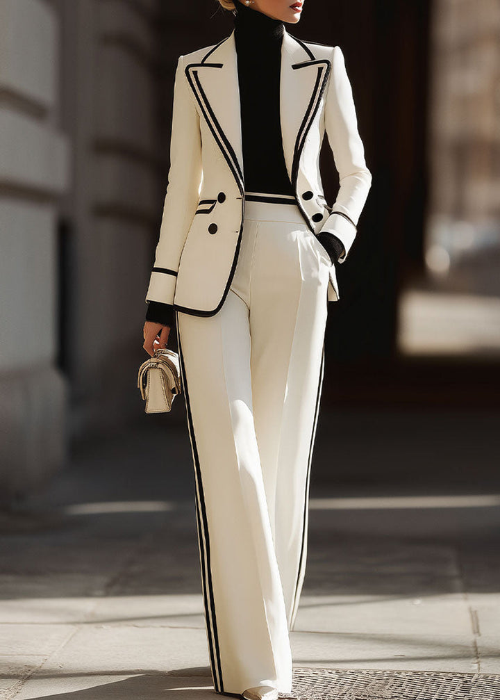 Elegant women's white double-breasted suit with chic contrast trim. Perfect professional office attire or formal event.