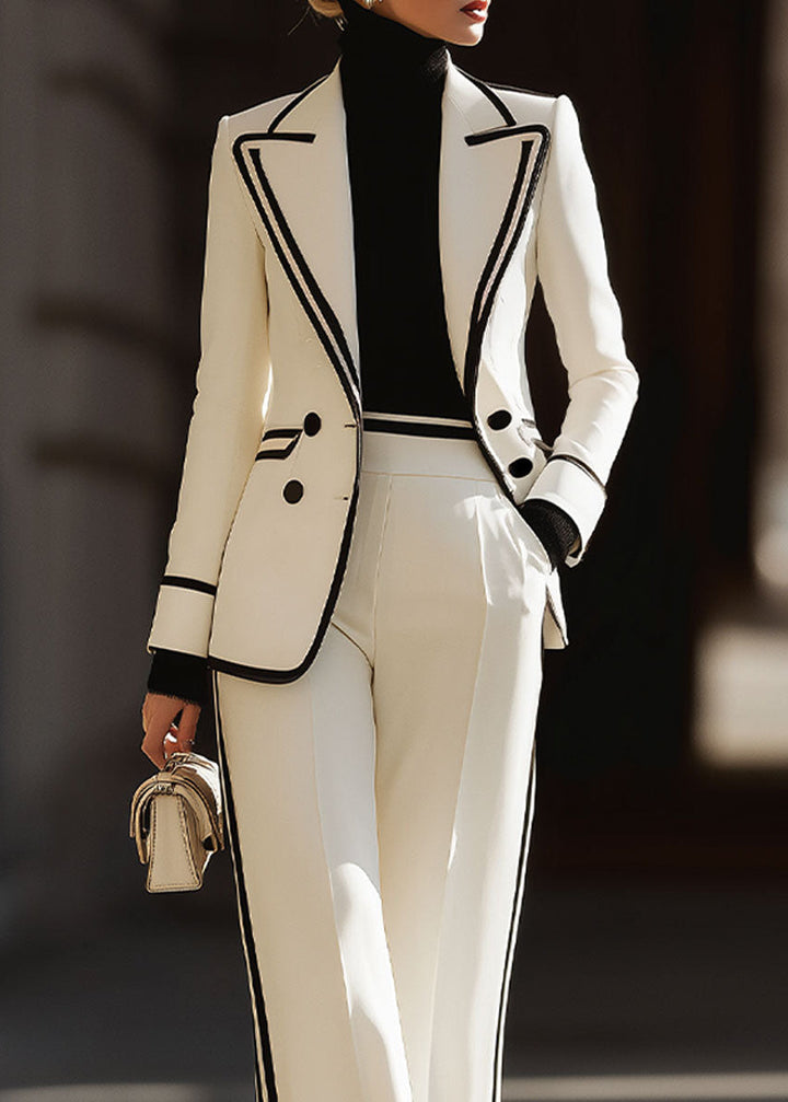 Stylish women's white power suit: double-breasted blazer & wide-leg trousers with elegant contrast trim detail.