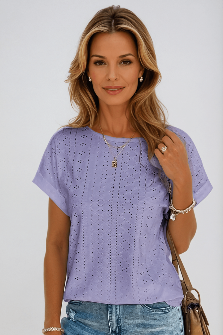 Textured eyelet short sleeve women's top with round neck. Breezy, lightweight, and comfortable for summer.