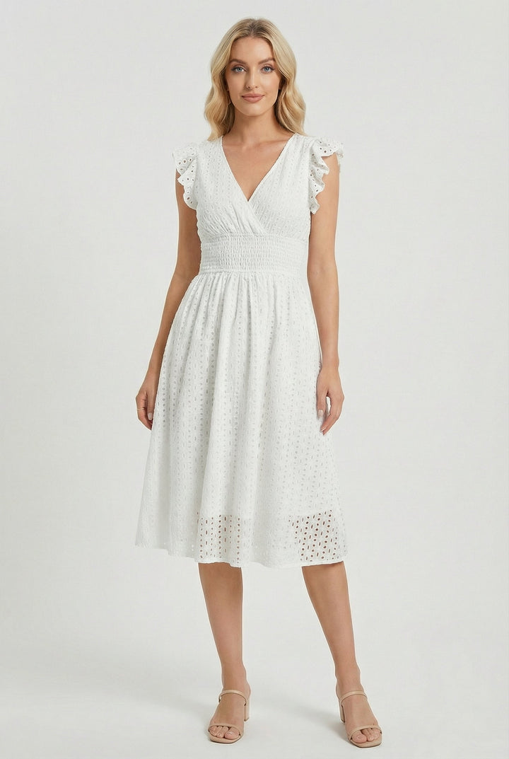 Women's white flared eyelet midi dress with ruffled sleeves, perfect for summer style.