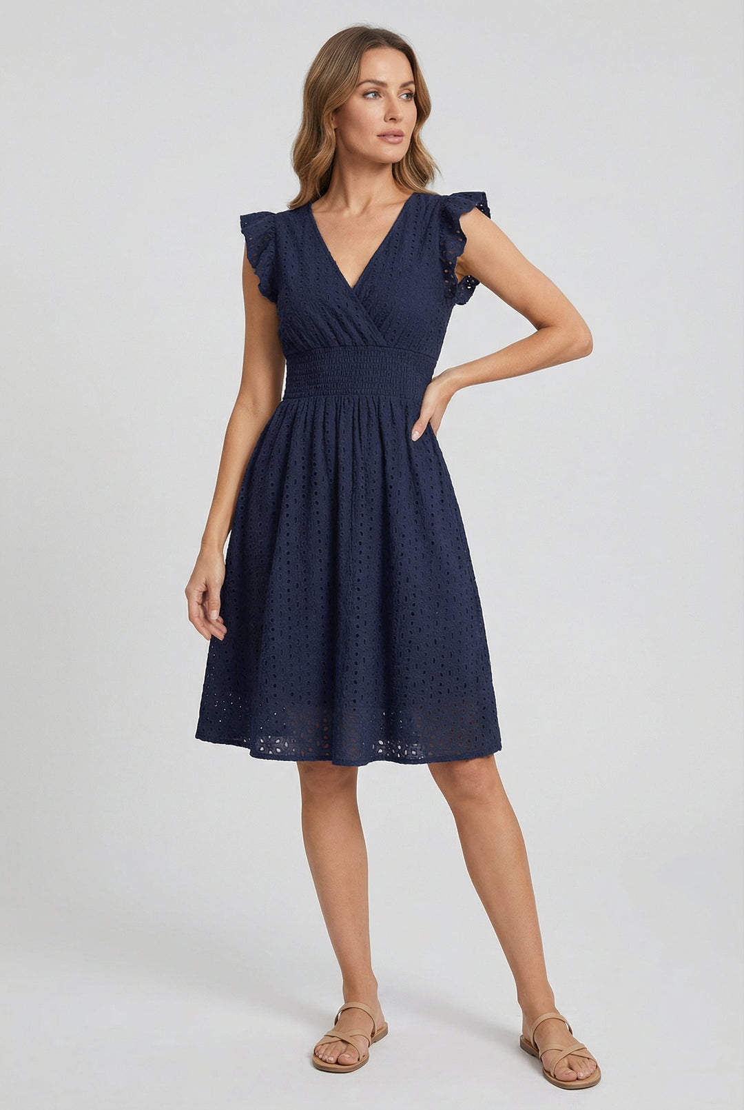Chic women's flared midi dress with an eyelet design and elegant ruffled sleeves.