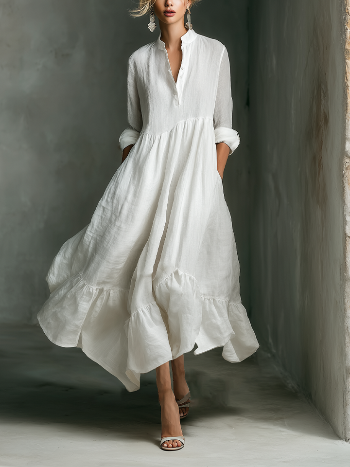 Women's white tiered maxi dress with stand collar, long sleeves, and flowy silhouette for summer comfort.
