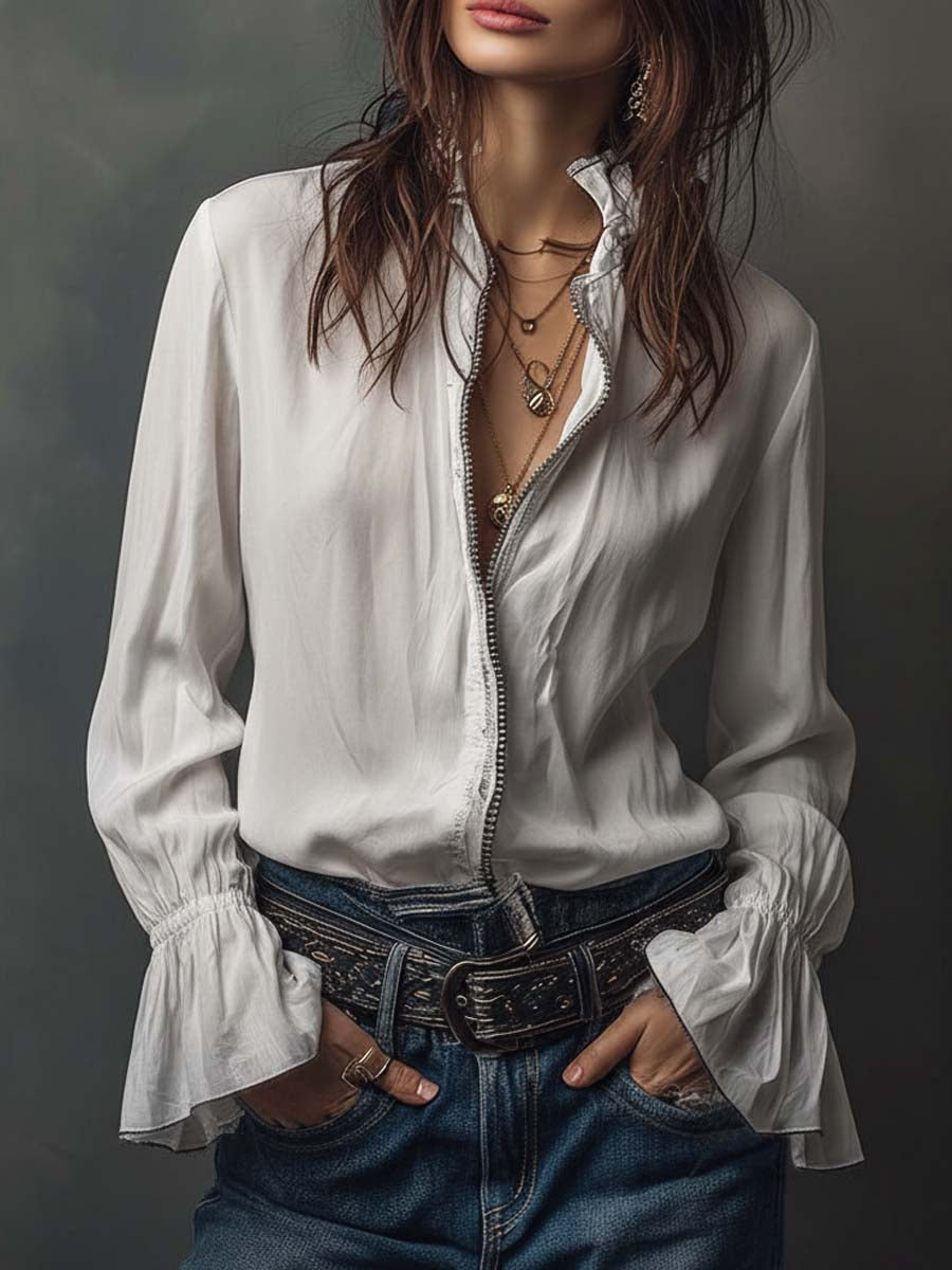 Women's white zip-front blouse with elegant bell cuffs and long sleeves. Perfect versatile tailored top.