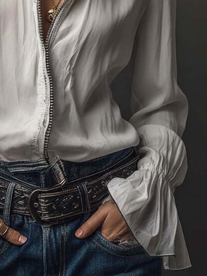White long-sleeve women's blouse, zip-front closure, and elegant bell cuffs. A modern tailored fit top.