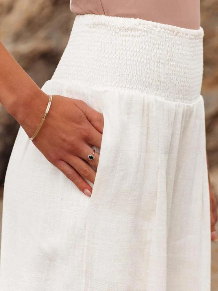 Stylish women's wide leg beach pants in a light, flowing fabric. Elastic waist ensures comfort for any summer activity.