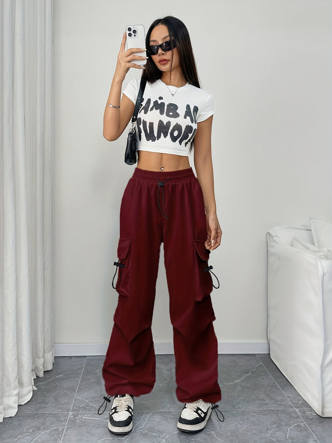 Stylish women's wide leg cargo pants, drawstring waist, multiple utility pockets. Perfect for streetwear.