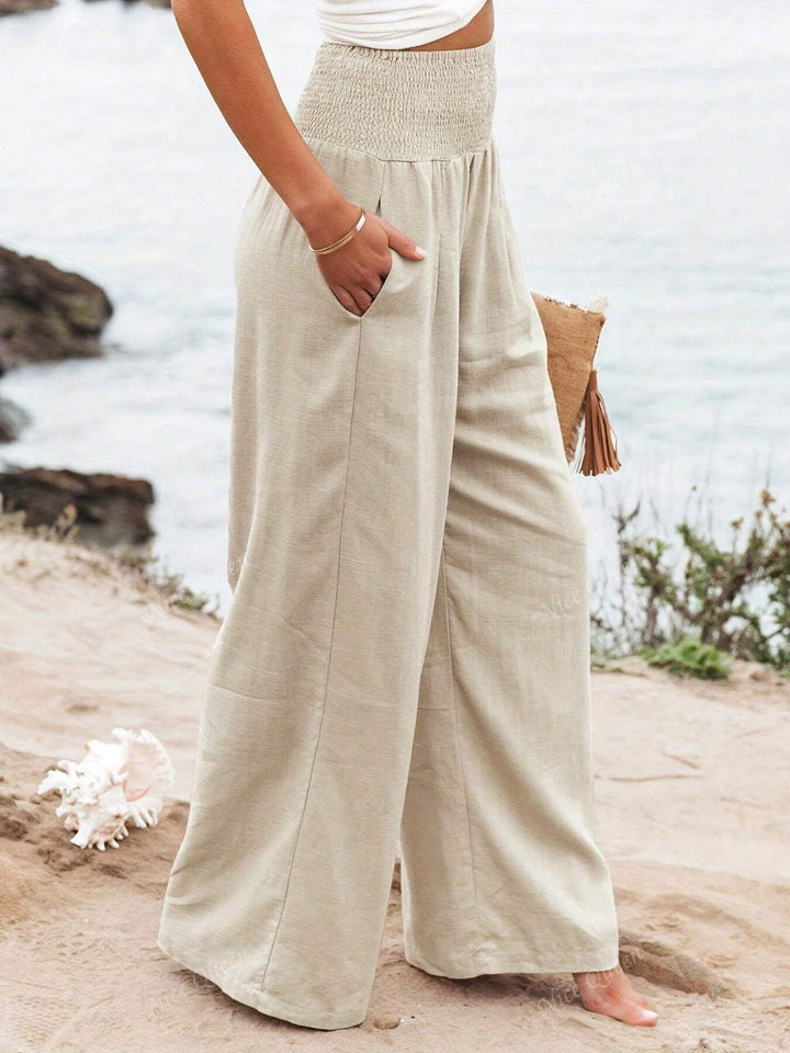 Casual women's flowy wide leg pants. Comfortable, relaxed fit linen trousers for everyday fashion.