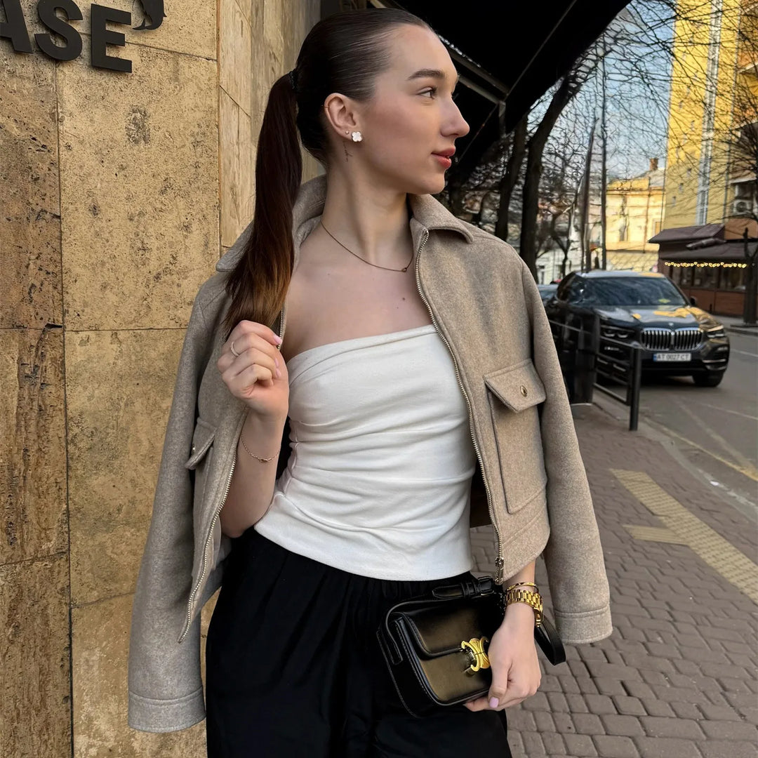 Women's wool bomber jacket in black, front view with zipper closed, perfect for winter and casual outerwear.