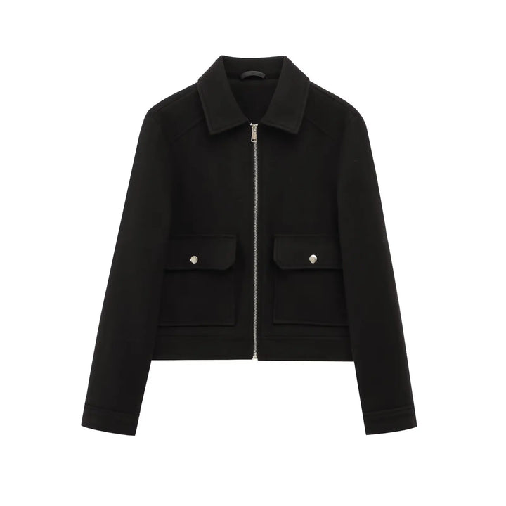 Close-up of the smooth zipper on a women's wool bomber jacket, emphasizing quality and functional design.