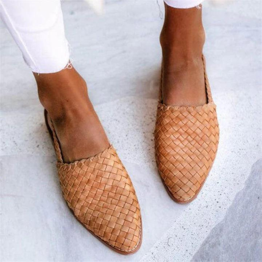 Womens slip-on backless loafers with a chic pointed toe. Textured woven flats ideal for comfort and style.