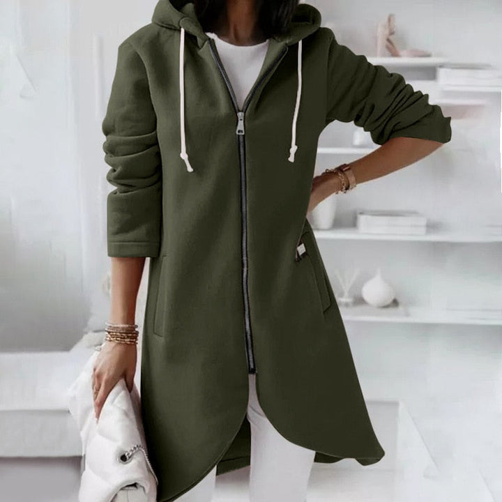 Stylish ladies sleeveless jacket with a hood and zipper, offering versatile outerwear for casual wear.