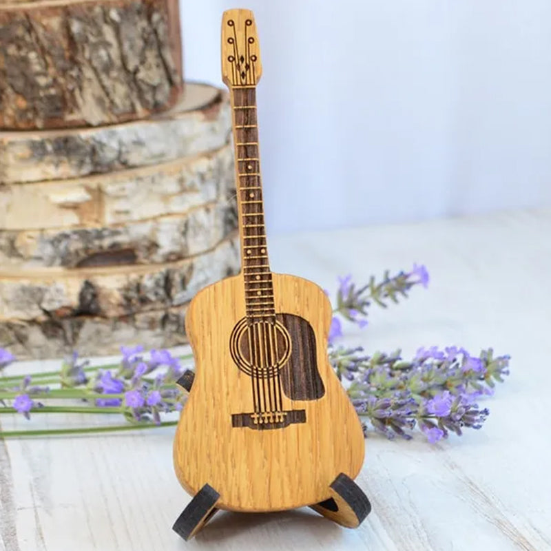 Wooden guitar pick stand and box, ideal for acoustic guitar players.