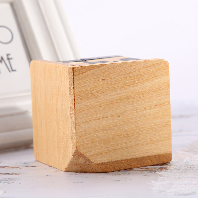 Child concentrating on solving a wooden brain teaser puzzle, demonstrating problem-solving skills
