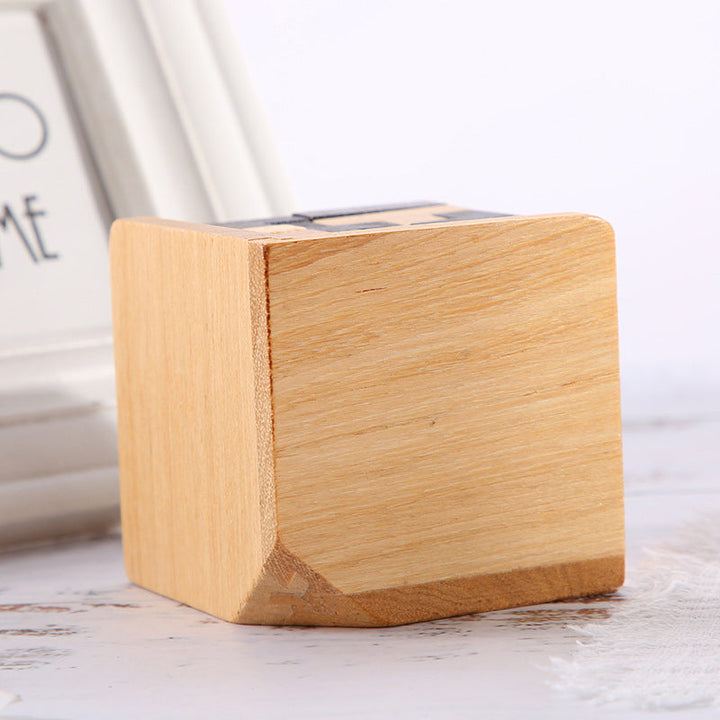 Child concentrating on solving a wooden brain teaser puzzle, demonstrating problem-solving skills