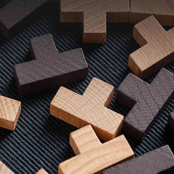 Unassembled wooden brain teaser puzzle pieces, showing the challenge of the intelligence toy