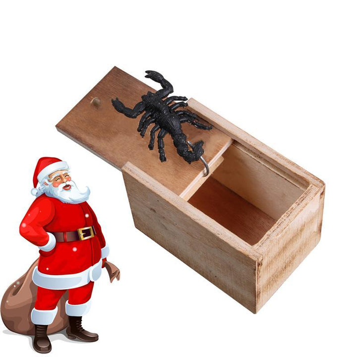 Open prank scare box revealing a faux spider, an amusing wooden gag gift