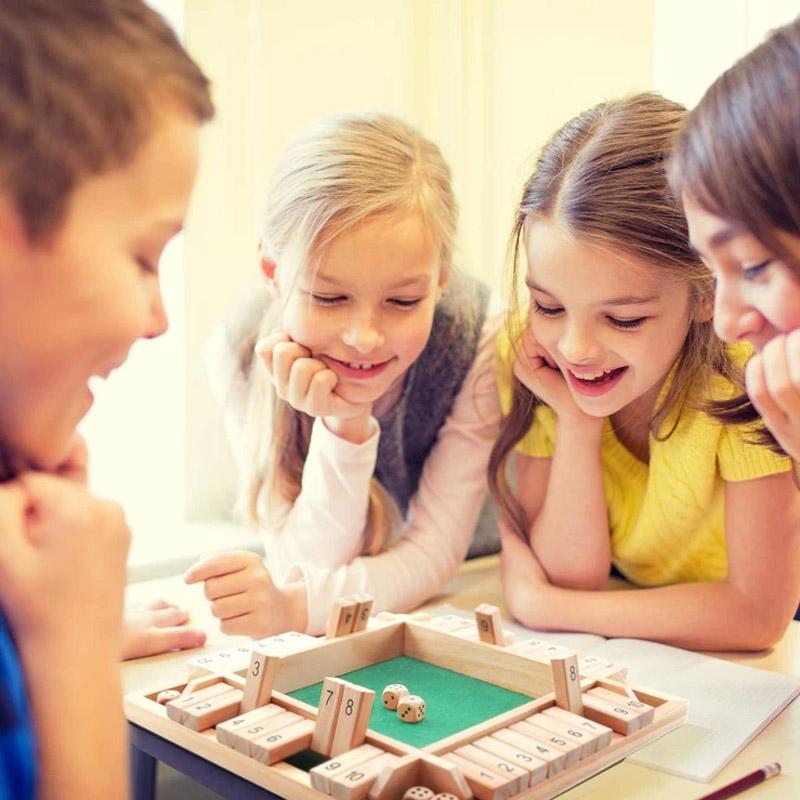 Close-up of a wooden Shut The Box game, showcasing numbers and dice, a fun family board game