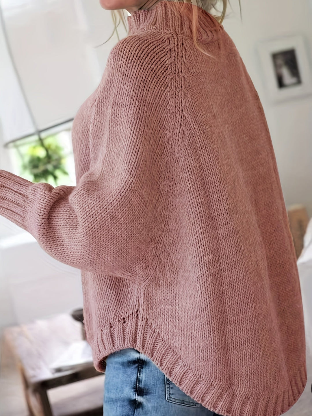 Wren women's oversized patterned sweater with a high neck, long batwing sleeves, & stylish flare hem.