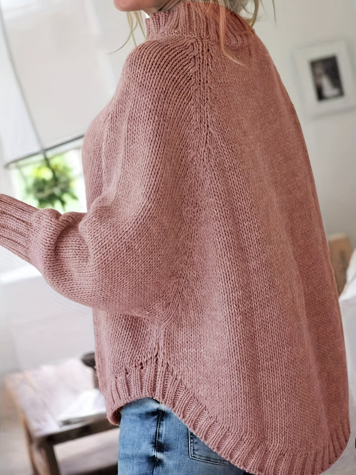 Wren women's oversized patterned sweater with a high neck, long batwing sleeves, & stylish flare hem.