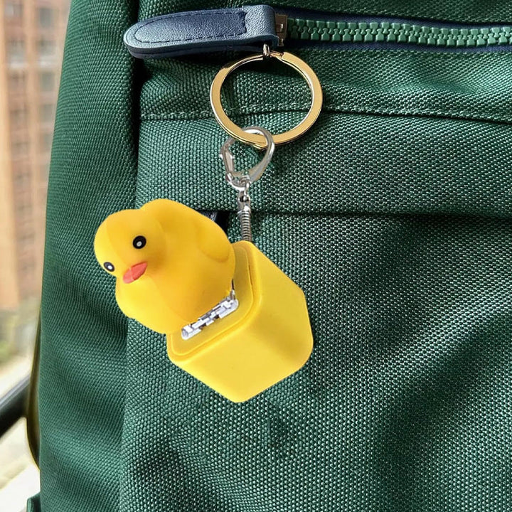 Collection of duck sound fidget keychains, vibrant yellow novelty toys.